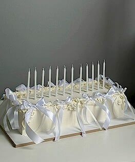 Вытянутый Свадебный торт с бантиками и свечами